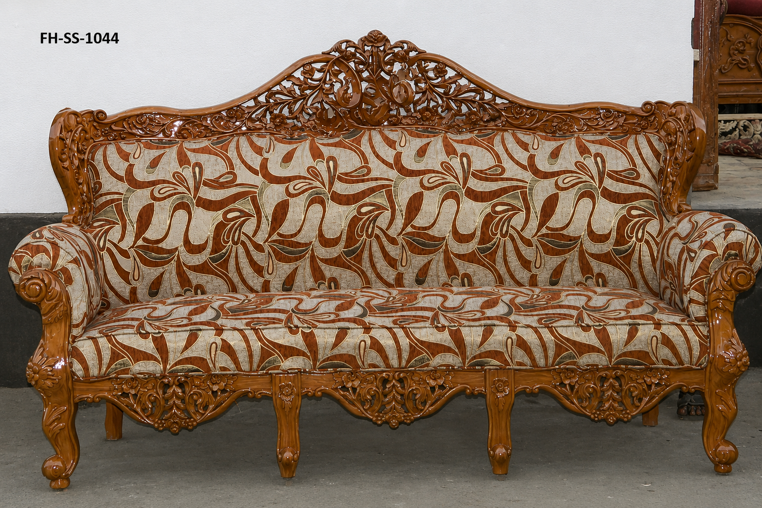 Elegant hand-carved wooden sofa set with intricate vine detailing and premium abstract patterned upholstery