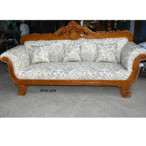 Luxurious handcrafted wooden sofa set featuring intricate royal carvings, elegant floral upholstery, curved armrests, and matching cushions in a classic traditional design.