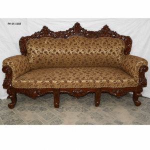 Luxury handcrafted wooden sofa set with intricate floral carvings, rich brown patterned upholstery, rolled armrests, and a majestic royal-inspired design.