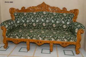 Luxury hand-carved wooden sofa set with elegant green floral upholstery and traditional royal craftsmanship.