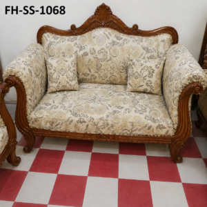 Elegant carved wooden sofa set with cream floral upholstery, handcrafted detailing, plush cushioning, and timeless royal-inspired design.