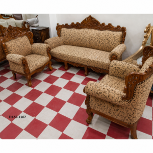 Elegant handcrafted wooden sofa set with intricate carvings, premium floral upholstery, and classic royal styling, including a three-seater sofa and matching armchairs.