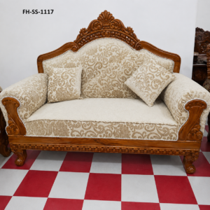 Elegant handcrafted wooden loveseat featuring a carved crown backrest, premium cream scroll-pattern upholstery, rolled armrests, and decorative accent cushions.