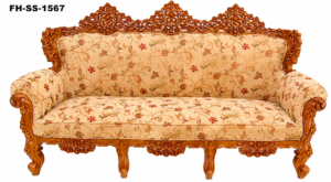 Elegant handcrafted solid wood sofa with intricate floral carvings, premium beige floral upholstery, rolled armrests, and a luxurious high-back royal design.