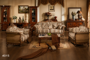 Luxury handcrafted wooden sofa set featuring elegant carved wooden frames, striped premium upholstery, matching armchairs, decorative cushions, and a classic coffee table in a sophisticated living room.