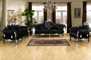 Elegant black luxury sofa set featuring silver hand-carved wooden accents, premium velvet upholstery, matching armchairs, decorative cushions, and a sophisticated classic living room setting.