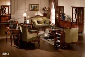 Elegant olive green luxury sofa set with handcrafted solid wood frame, premium upholstered seating, carved wooden accents, matching armchairs, coffee table, and coordinating display cabinet in a classic living room.