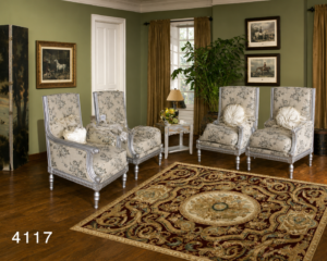 Luxury wingback accent chair set featuring four handcrafted high-back chairs with carved wooden frames, elegant silver finish, floral upholstery, and plush cushions in a classic living room.