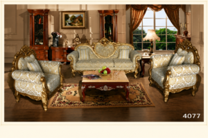 Luxury red upholstered sofa set with carved solid wood frame, elegant patterned fabric, matching accent chair, and marble-top coffee table in a classic living room.