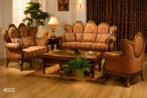 Luxury traditional wooden sofa set with intricately hand-carved solid wood frame, premium beige upholstery, decorative cushions, and matching wooden center table.