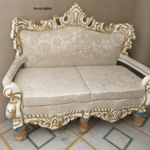 A beautifully handcrafted two-seater sofa featuring an intricately carved solid wood frame with an elegant ivory white and antique gold finish. Upholstered in premium floral jacquard fabric, this luxurious sofa showcases timeless European-inspired craftsmanship, making it an exquisite addition to luxury homes, hotels, villas, and palace-style interiors.