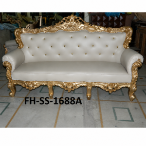 A luxurious handcrafted sofa featuring an intricately carved solid wood frame with an elegant antique gold finish and premium white leather upholstery. Designed with crystal button tufting, ornate floral carvings, and a regal crown crest, this European-inspired masterpiece adds timeless elegance to luxury homes, hotels, villas, and palace-style interiors.