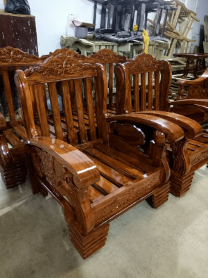 A premium Handcrafted Solid Wood Single Seater Armchair featuring a beautifully carved solid wood frame with elegant traditional craftsmanship. Designed with broad wooden armrests, decorative backrest detailing, and a sturdy structure, this armchair offers the perfect blend of durability, comfort, and timeless style for living rooms, lounges, offices, hotels, and reception areas.