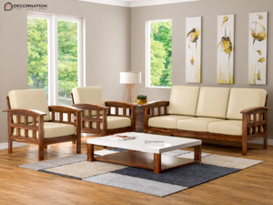 A beautifully crafted Premium Solid Wood Sofa Set (3+1+1) featuring a premium solid wood frame with a warm walnut finish and soft beige fabric upholstery. The set includes one spacious 3-seater sofa, two matching single-seater armchairs, and a coordinating center table, making it a perfect choice for modern living rooms, apartments, offices, lounges, hotels, and reception areas.