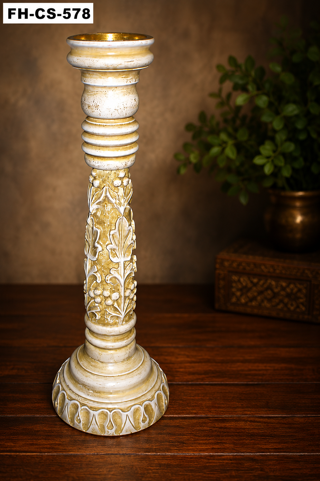 A beautifully crafted Luxury Antique Decorative Candle Stand featuring an elegant white and gold distressed finish with intricate floral carvings and a premium handcrafted design. Its tall pedestal silhouette and classic detailing make it an eye-catching decorative accessory for homes, hotels, restaurants, weddings, churches, festive celebrations, and luxury interior spaces.