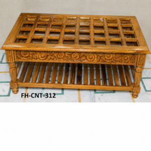 A premium Handcrafted Wooden Carved Glass Top Coffee Table featuring a transparent glass tabletop, elegant floral carvings on the front panel, polished wooden finish, turned legs, and a spacious lower shelf. This classic design combines traditional craftsmanship with practical storage.
