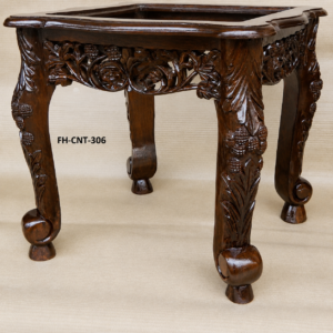 A premium Handcrafted Antique Wooden Console Table featuring a rich dark wood finish, intricate floral carvings, curved legs, and a classic traditional design. This elegant furniture piece showcases detailed craftsmanship and adds a luxurious vintage touch to any interior space.