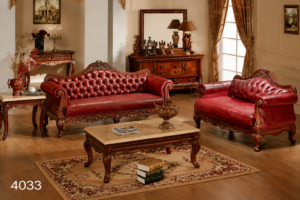 A luxurious red Chesterfield sofa set featuring premium leather upholstery, deep button tufting, elegant rolled arms, handcrafted wooden detailing, and a classic royal design. Perfect for creating a sophisticated and timeless living space.