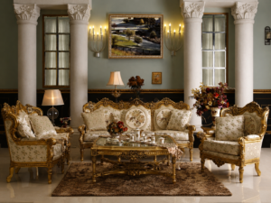 Elegant luxury sofa set with cream floral upholstery, antique gold carved wooden frame, matching coffee table, and classic European-inspired living room décor.