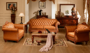 Elegant luxury Chesterfield sofa set featuring premium burgundy leather upholstery, deep button tufting, handcrafted solid wood frame, intricate carvings, and timeless European-inspired design.