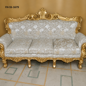 A luxurious handcrafted three-seater sofa featuring an intricately carved solid wood frame with an antique gold finish, elegant silver-grey floral upholstery, and classic European-inspired detailing. Designed to add sophistication and timeless beauty to luxury homes, hotels, villas, and premium lounge spaces.