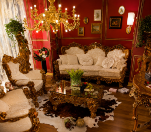 An opulent Baroque-inspired sofa set featuring a handcrafted solid wood frame, luxurious ivory fabric upholstery, intricate gold-finished carvings, and elegant European styling. Designed to create a grand statement in luxury living rooms, villas, palaces, and premium hospitality interiors.
