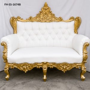 A luxurious handcrafted loveseat sofa featuring an ornate antique gold carved solid wood frame, premium white tufted upholstery, elegant scroll armrests, and decorative nailhead trim. Designed in a timeless European royal style, this loveseat is perfect for luxury living rooms, hotels, weddings, and premium interiors.