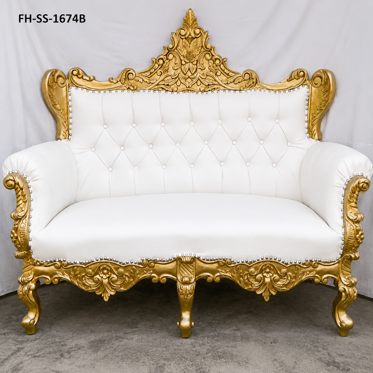 A luxurious handcrafted loveseat sofa featuring an ornate antique gold carved solid wood frame, premium white tufted upholstery, elegant scroll armrests, and decorative nailhead trim. Designed in a timeless European royal style, this loveseat is perfect for luxury living rooms, hotels, weddings, and premium interiors.